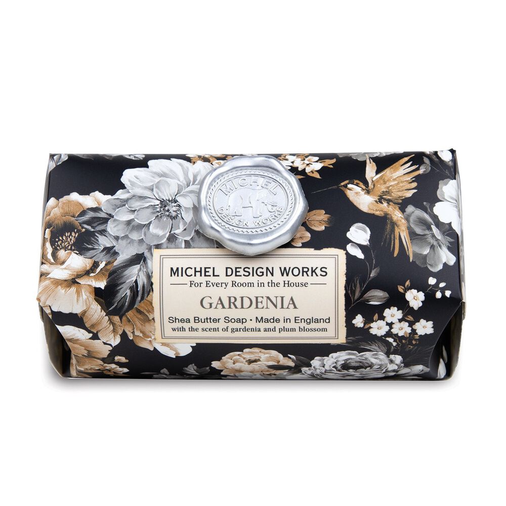 Gardenia Shea Butter Bath Soap Bar wrapped in paper printed with a black, white, and brown floral design.