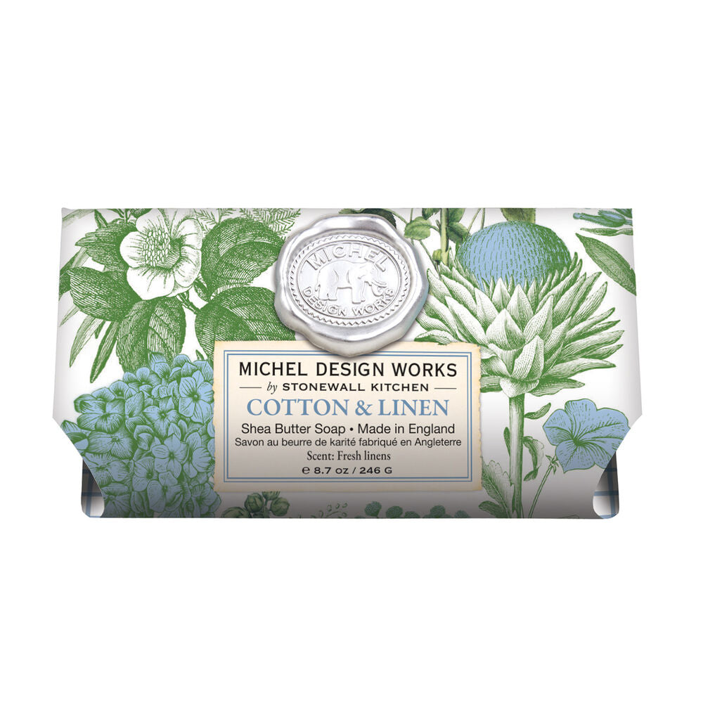 Cotton & Linen Shea Butter Bath Soap Bar wrapped in paper printed with blue and green florals.