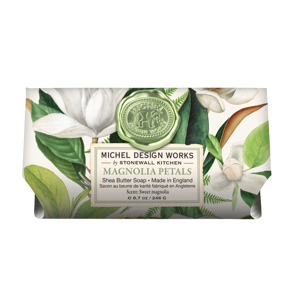  Magnolia Petals Shea Butter Bath Soap Bar wrapped in paper printed with a magnolia design.