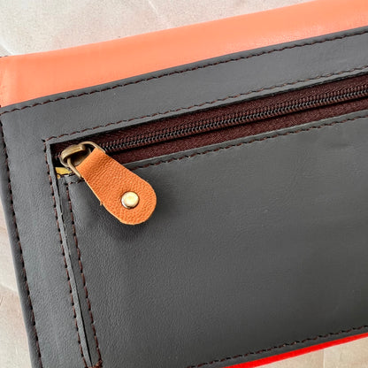 close-up of back of secret clutch wallet.