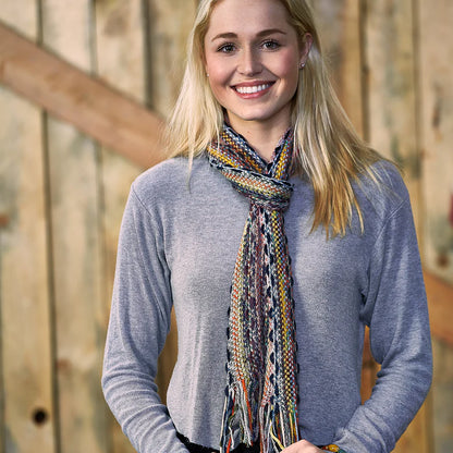 smiling person wearing grey top with Happy Squiggles Scarf around their neck