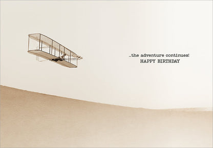 inside view of card has black and white photo of first plane flying in the desert with black text listed in the description