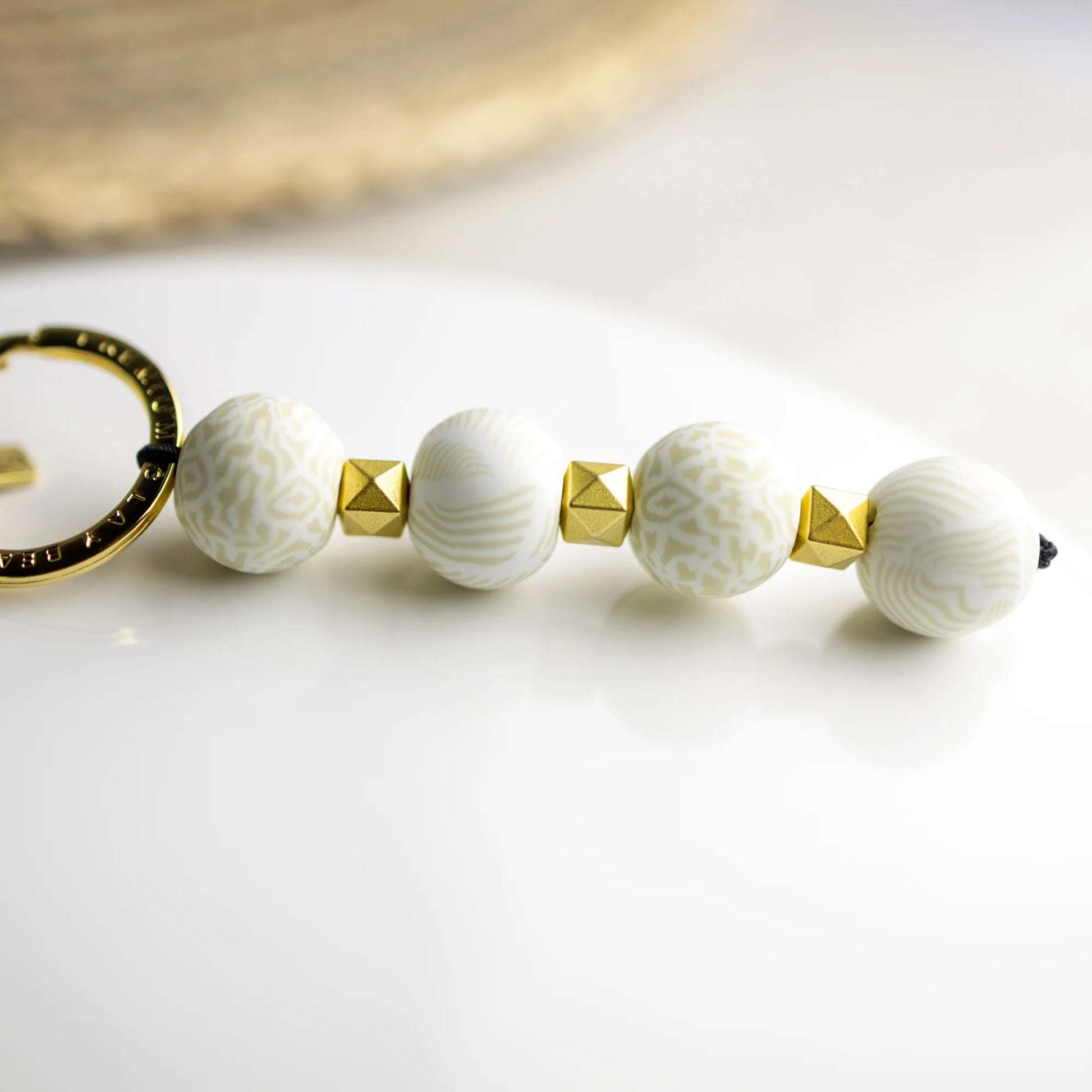 ivory palm Beaded Four-Ball Keychain.