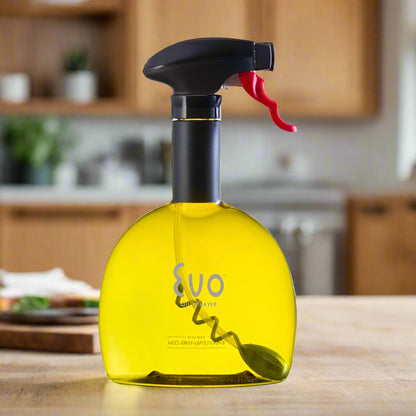 Yellow spray bottle with black and red nozzle on a kitchen counter