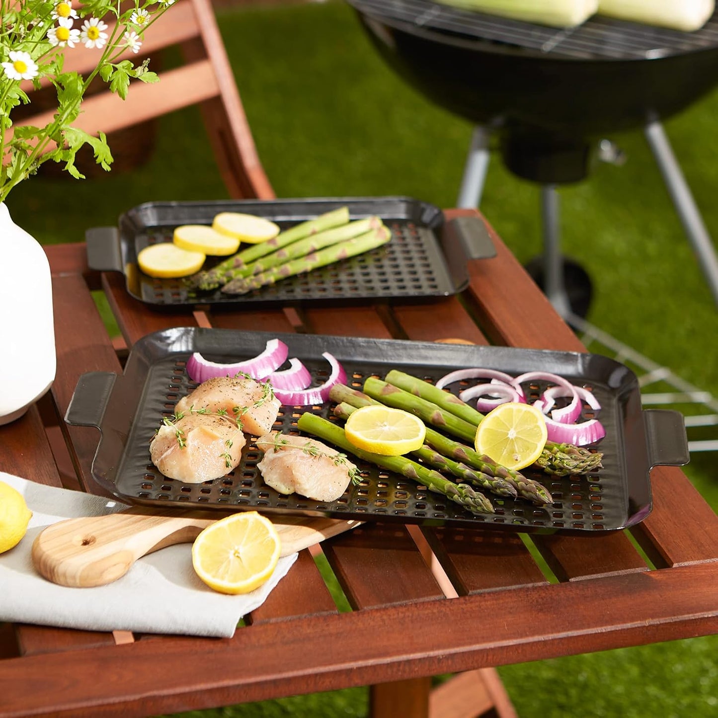 Porcelain Coated Grill Toppers filled with veggies set on a table