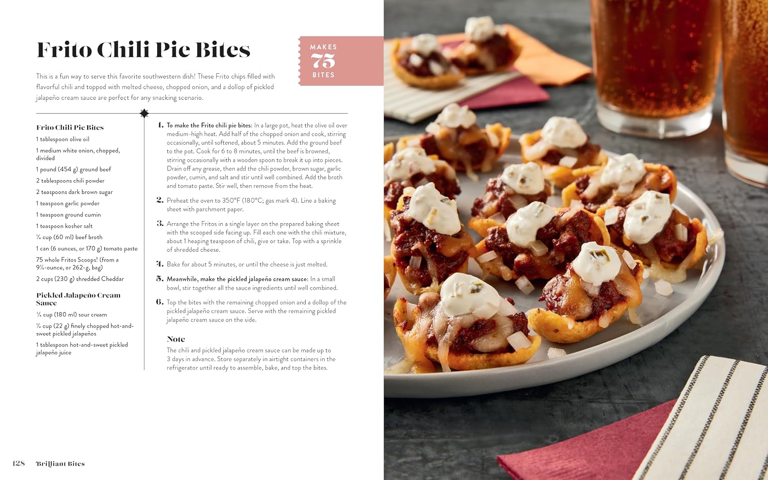 A printed recipe in book for Frito Chili Pie Bites placed over a food photo. The left side contains the recipe text, and the right side shows a close-up of the baked bites topped with red chili powder, with a glass of soda in the background.