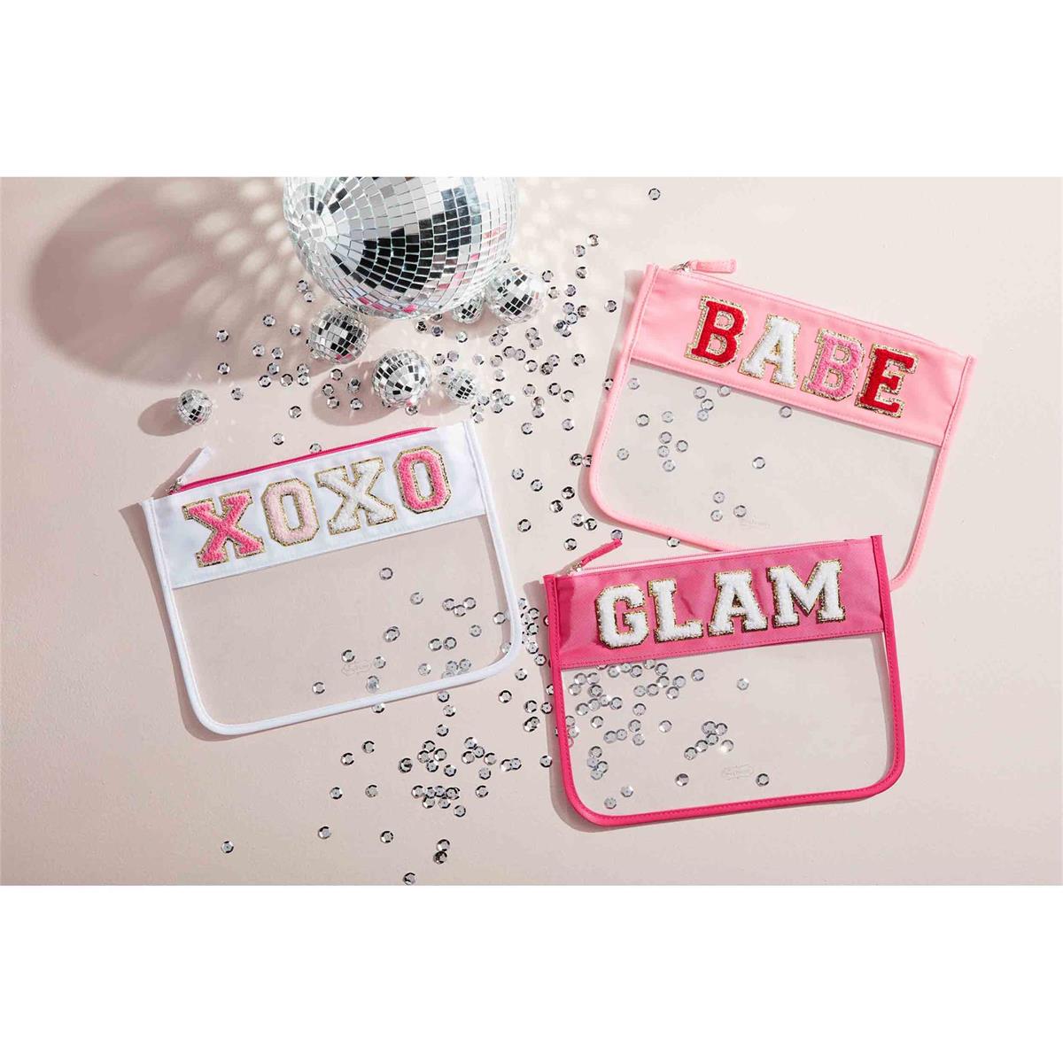 all three styles of clear patch cases displayed next to small disco balls and silver sequins on a light pink background