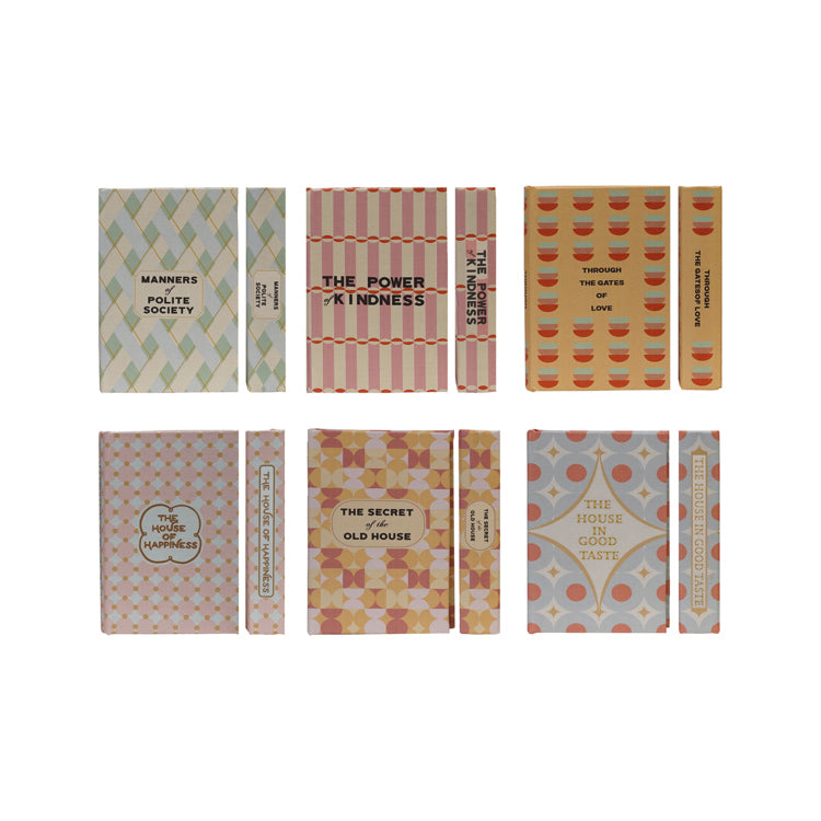 Set of small books with decorative covers in 2 rows on a white background