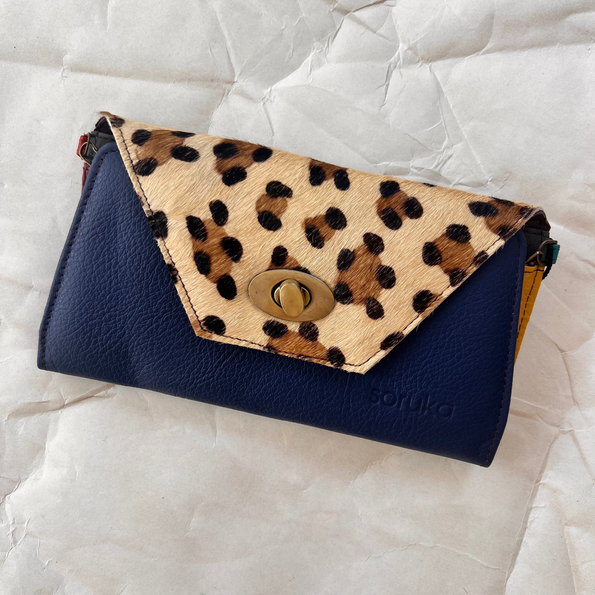 royal secret clutch wallet with cheetah print flap.