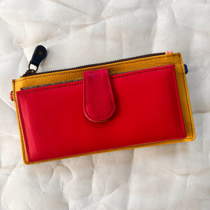 rectanglar kimber mustard wallet with raspberry colored pocket and pink tab closure.