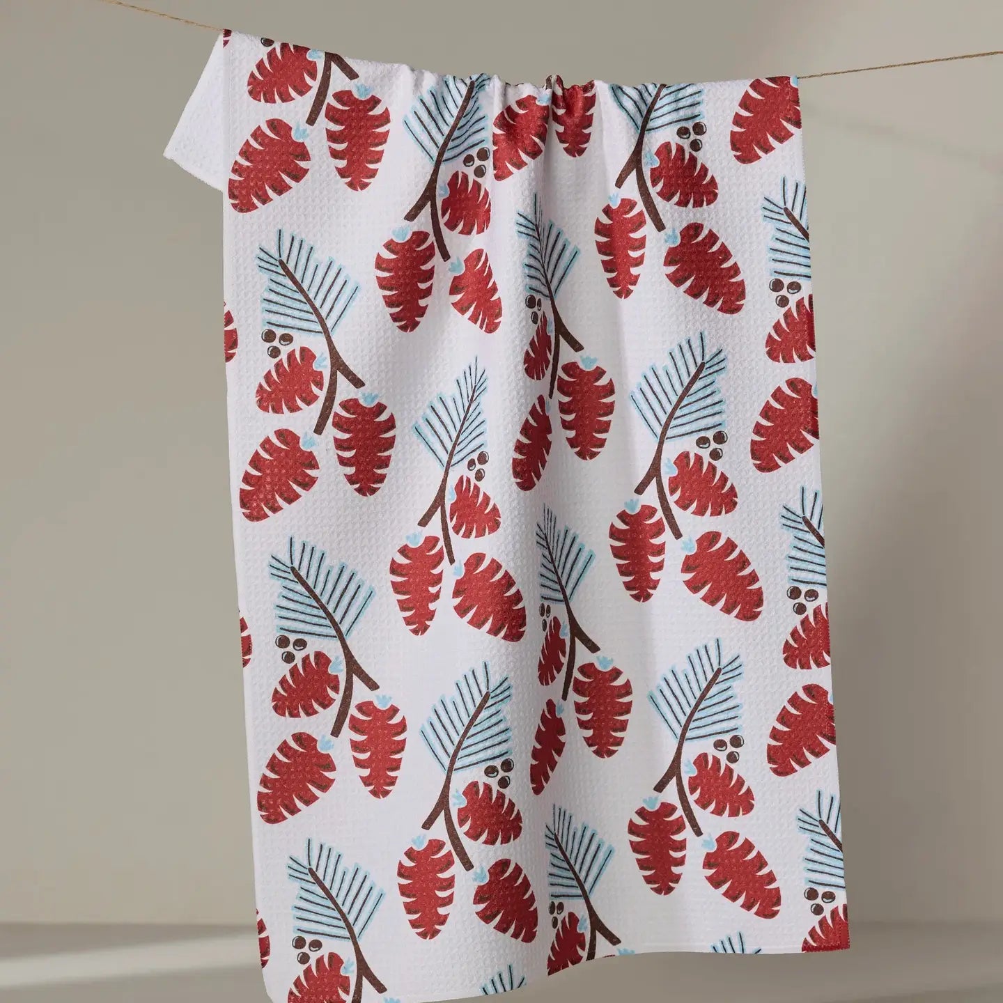 Winter Forage Tea Towel hanging on a line