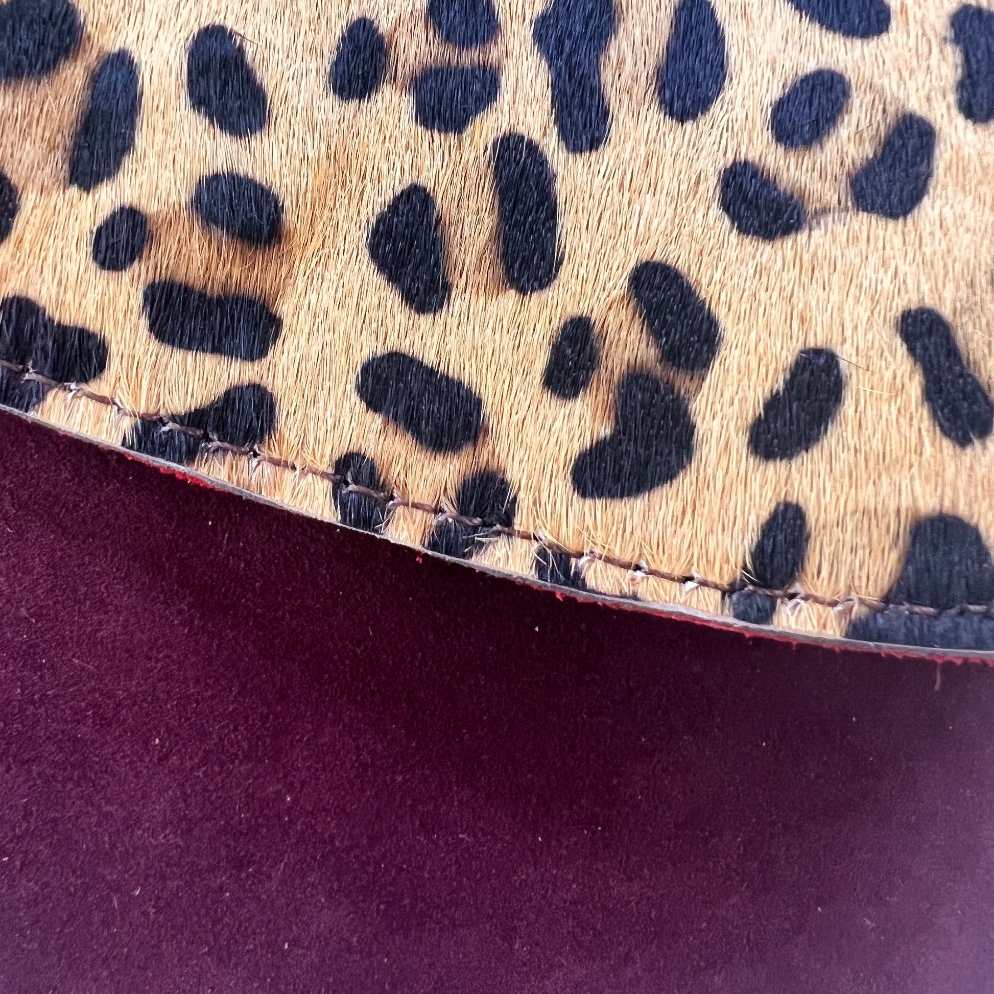 close-up on merlot leo purse.