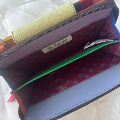 interior view of yellow Beatrice Clutch zippered compartment