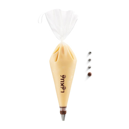 Pastry bag filled with cream and Lékué branding and tips in a row next to it  on a white background