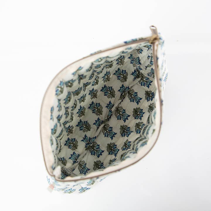 interior of view of white zipper bag with aqua floral block print design