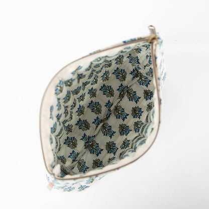 interior of view of white zipper bag with aqua floral block print design