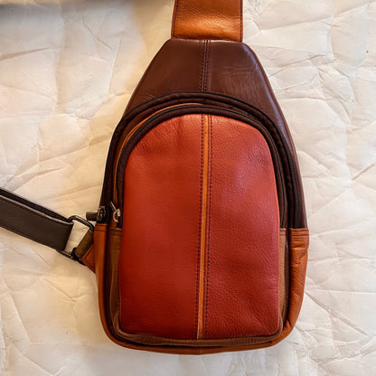 front view of rust Gregg sling bag.