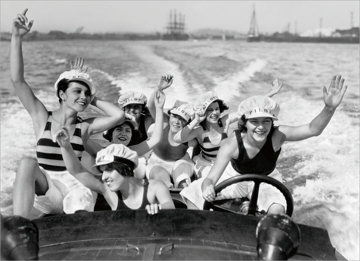front of card has a black and white photo of a group of women in a boat on the water