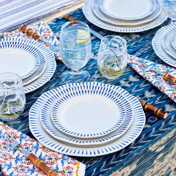 Sitio Stripe delft blue plates on a set dinner table