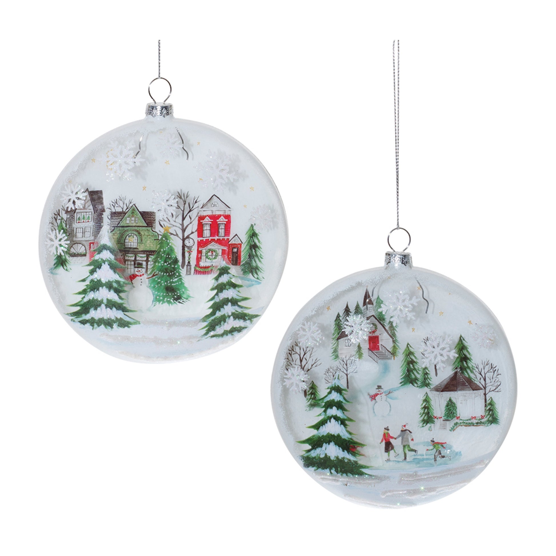 both styles of snow covered town disc ornaments displayed against a white background