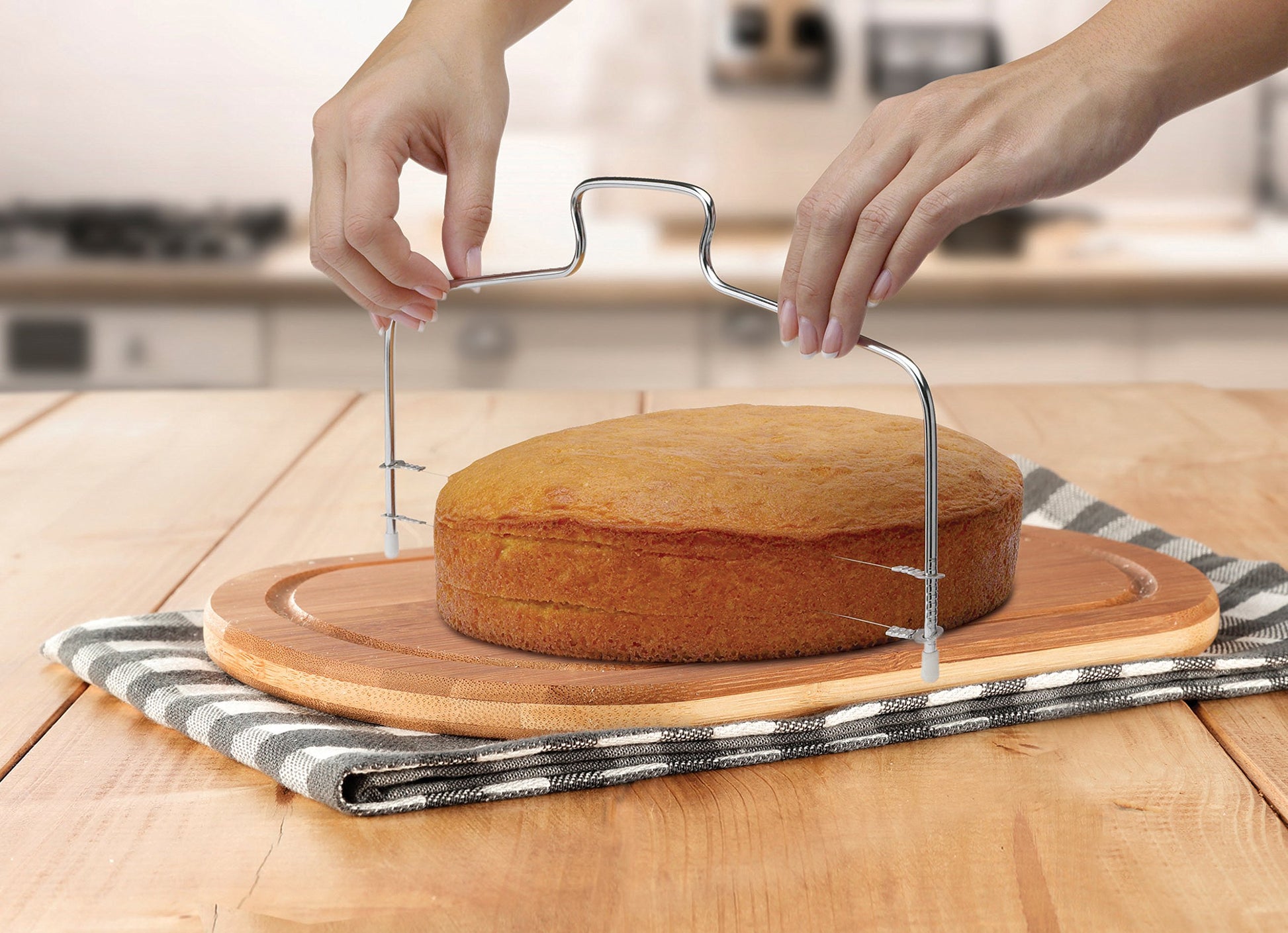 hands using Stainless Steel Cake Cutter to cut round cake into thin slices