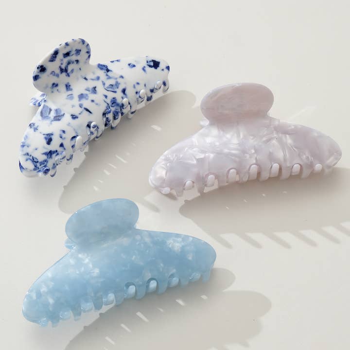3 assorted claw clips on a white background