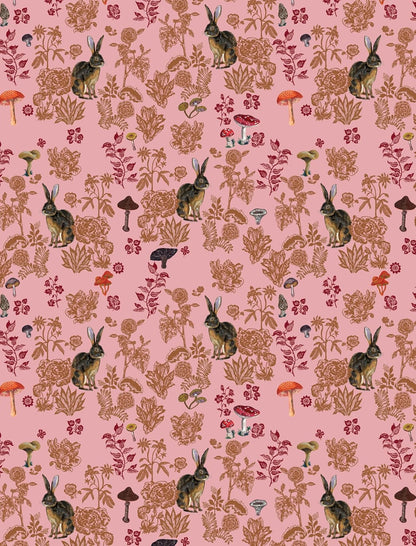 Patterned wrapping paper with rabbits, mushrooms, and foliage on a pink background