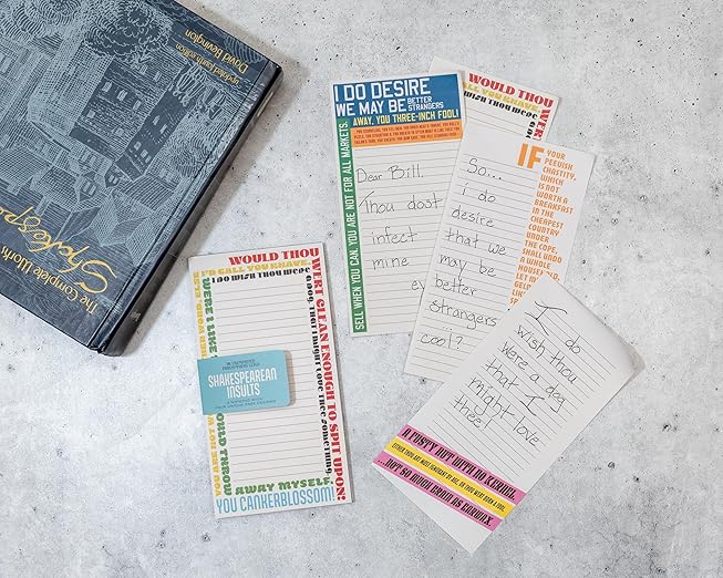 colorful pages from notepad with text on a textured surface