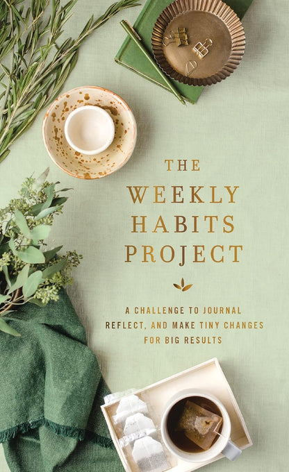 front cover of The Weekly Habits Project - light green with desk supplies and greenery printed on it