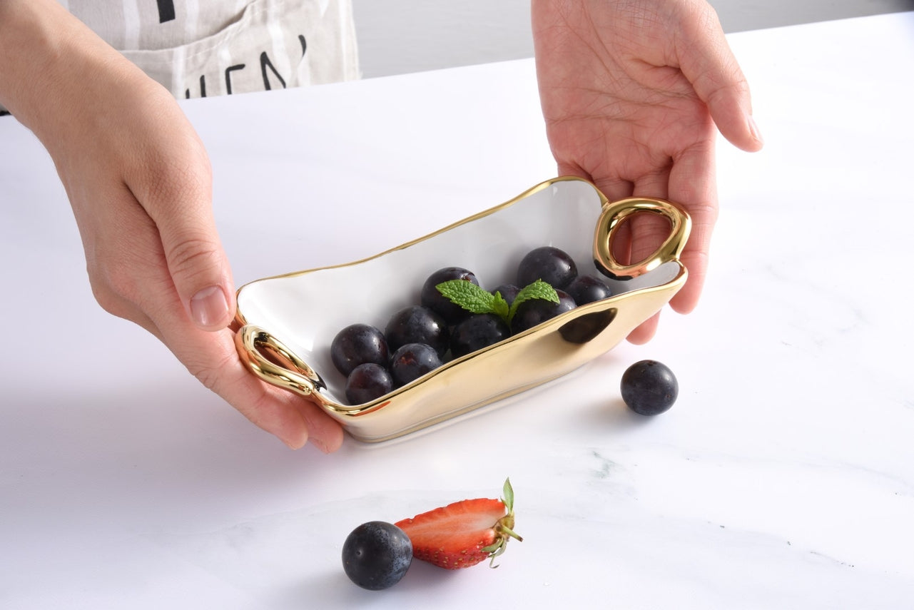 person holding the mini bowl filled with fruit