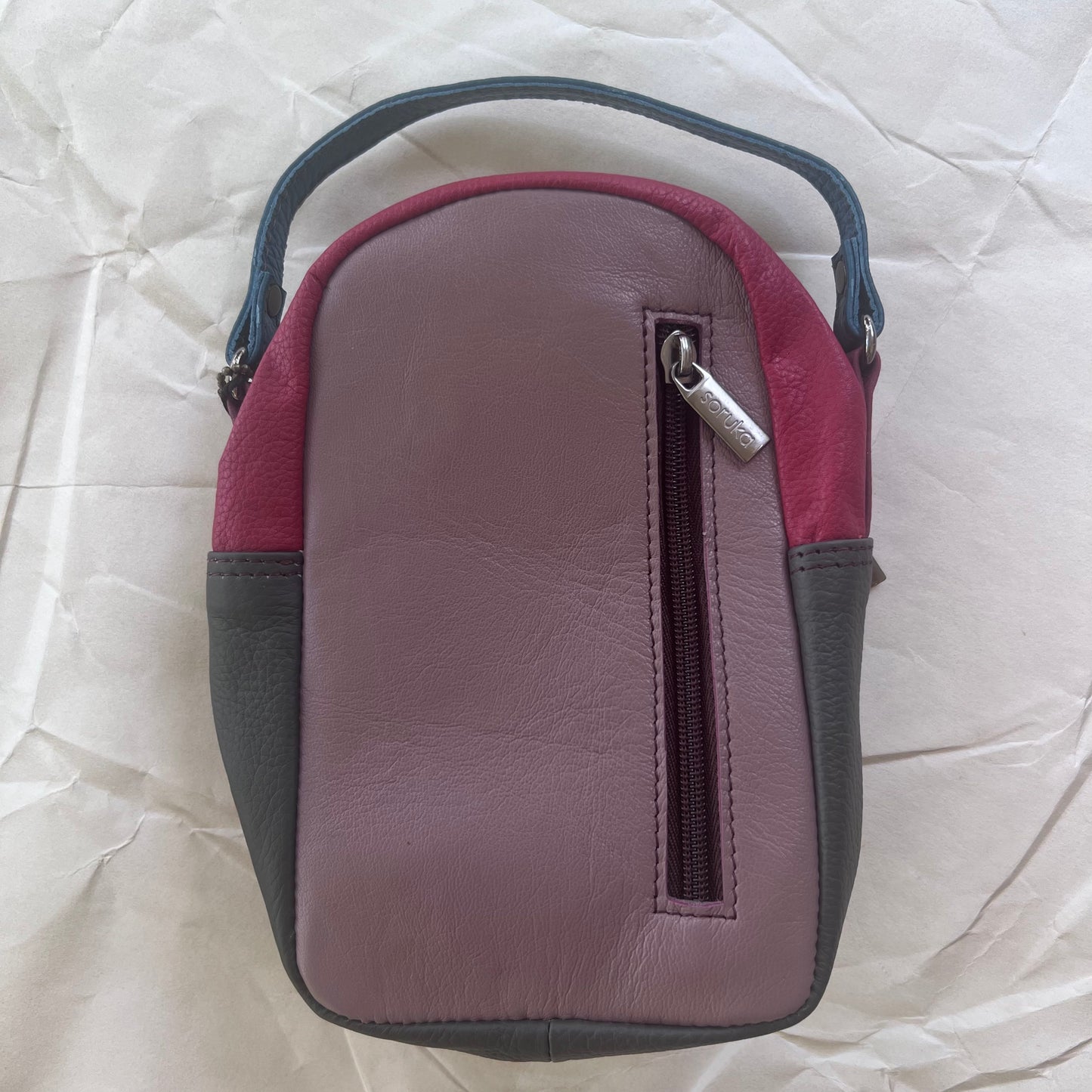 back view of Melon and fuchsia Ruth Small Backpack Crossbody