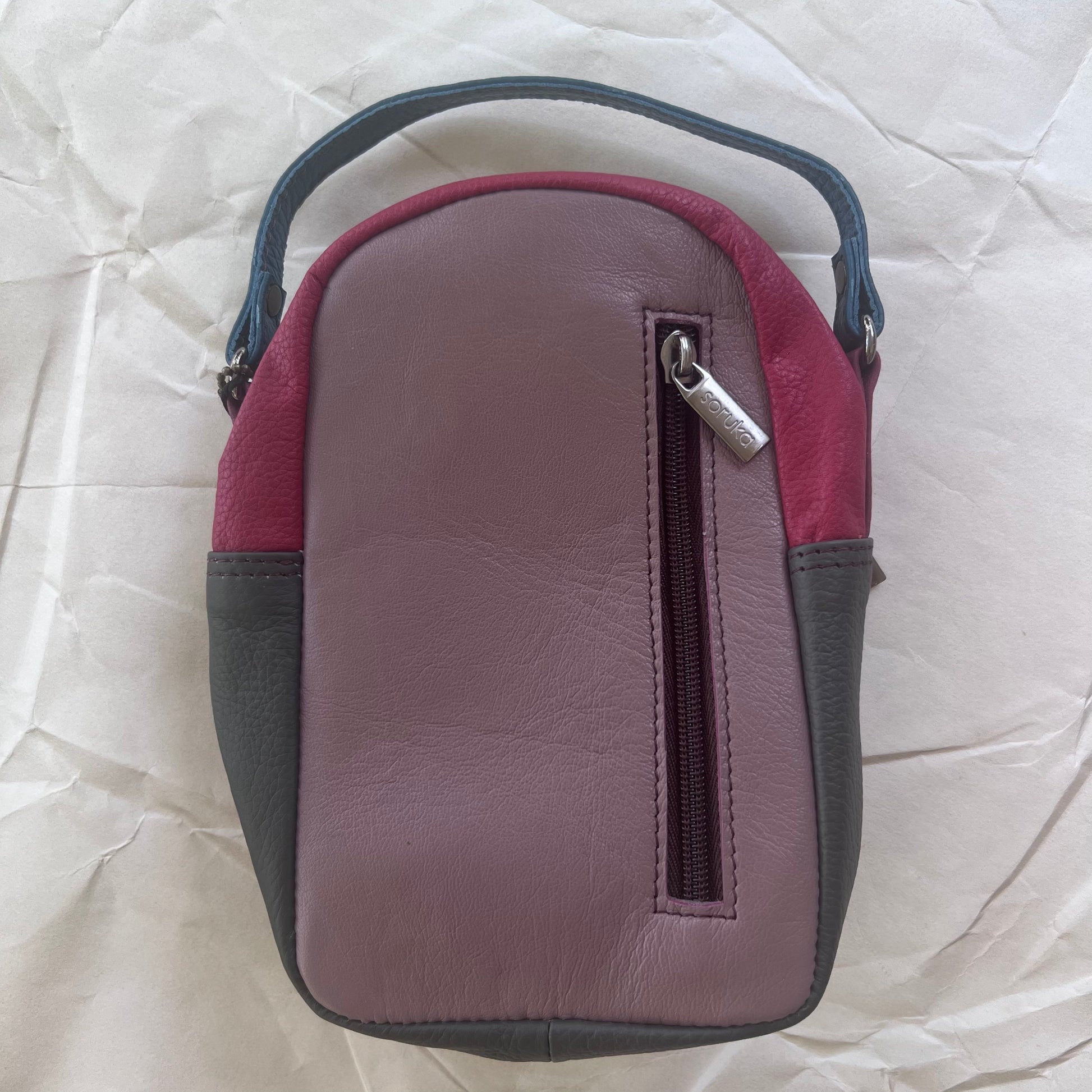 back view of Melon and fuchsia Ruth Small Backpack Crossbody