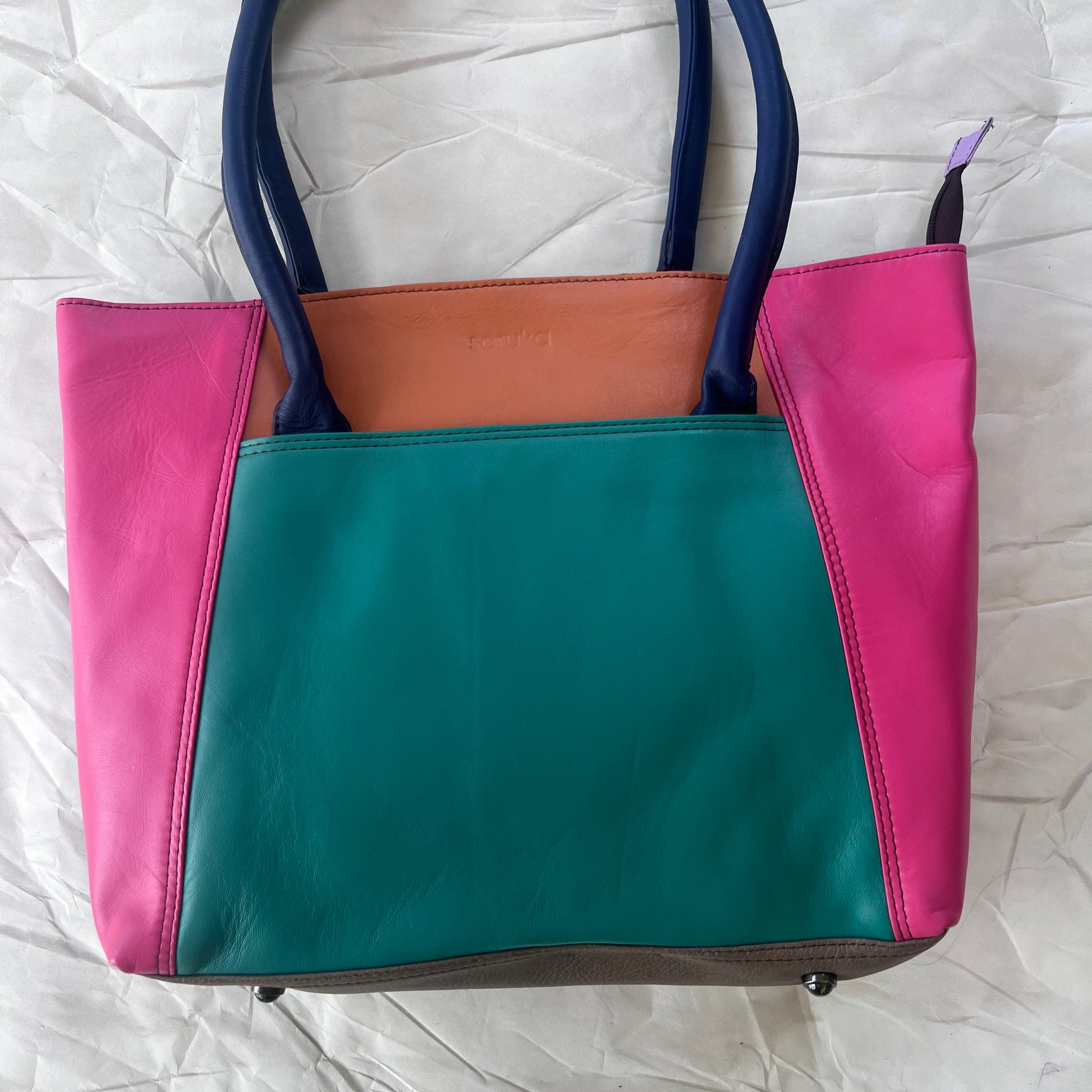 meadow sitges tote with color blocks of pink, teal and orange