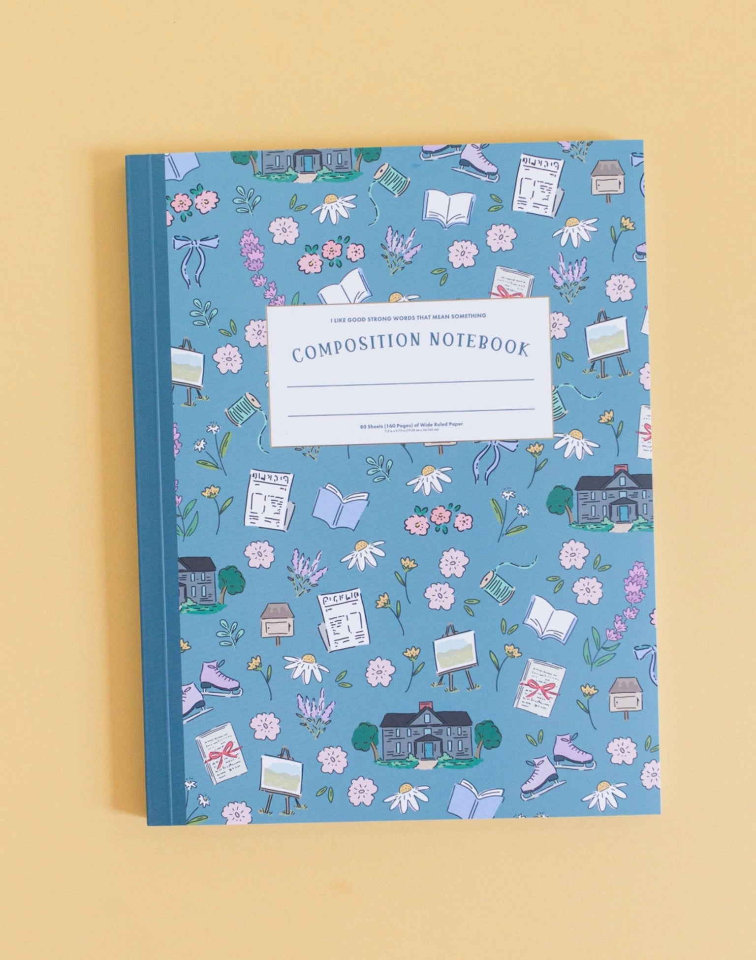 Composition notebook with a decorative cover on a beige background