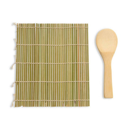 Bamboo mat with a wooden spoon nest to it on a white background