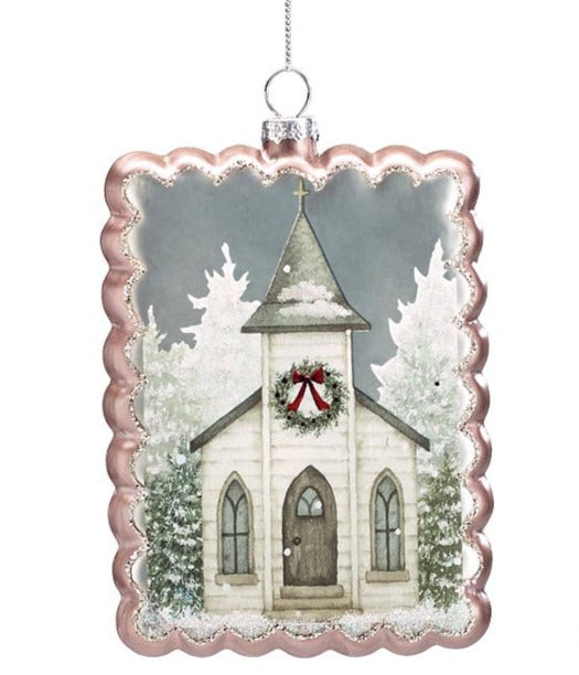 snowy church ornament has pale gold scalloping and displayed against a whtie background