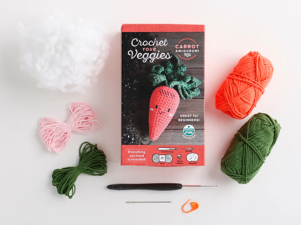 Crochet kit with yarns and hook on a white background