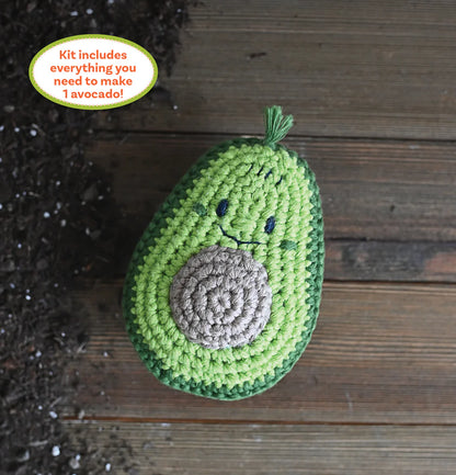 Crocheted avocado on a wooden surface