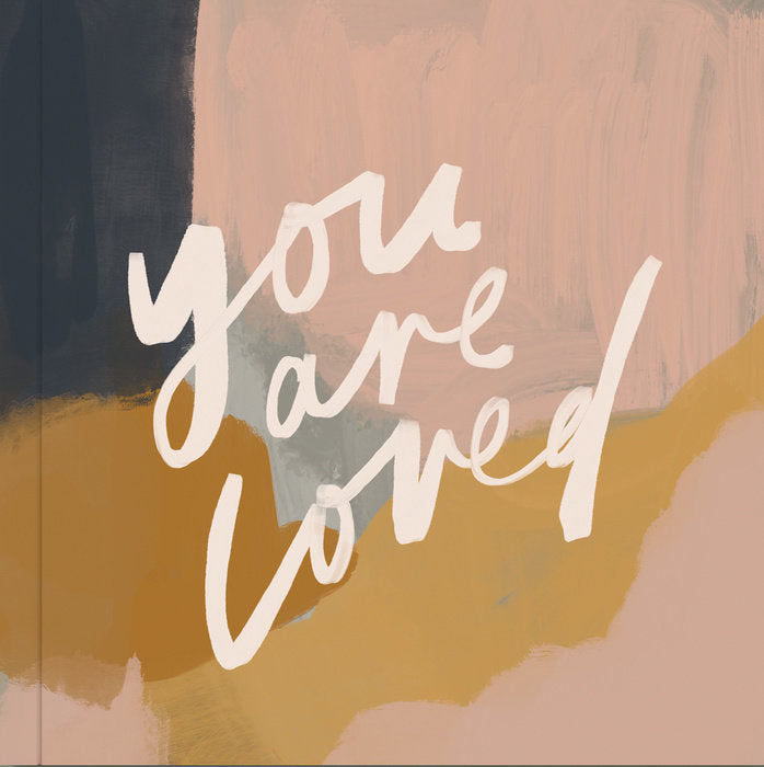 front cover of you are loved with an sbstract design in pinks, orange,a nd blue.