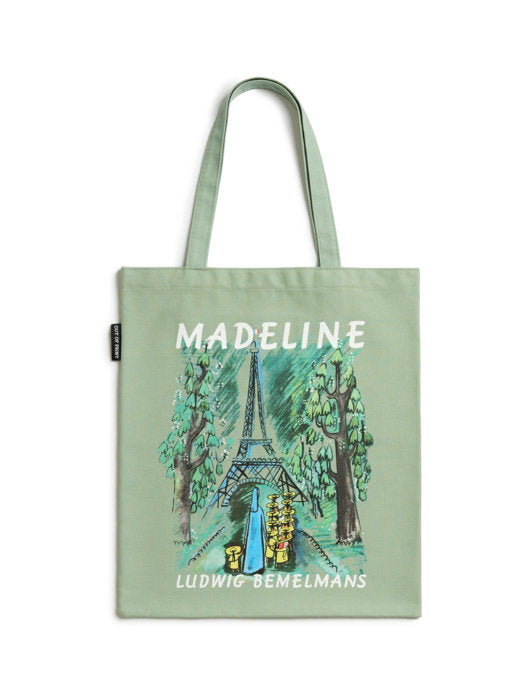 green tote bag featuring an image of Madeline walking towards the Eiffel Tower