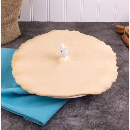 Pie Bird Vent in an uncooked pie on a kitchen counter