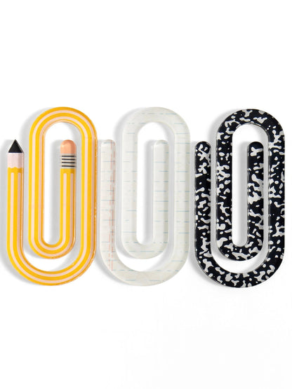 3 oversized paper clips on a white background
