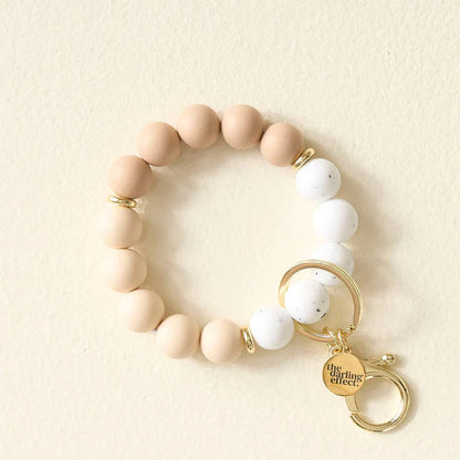 oatmilk latte Hands-Free Keychain Wristlet with silicone beads in pale brown and white with gold key ring