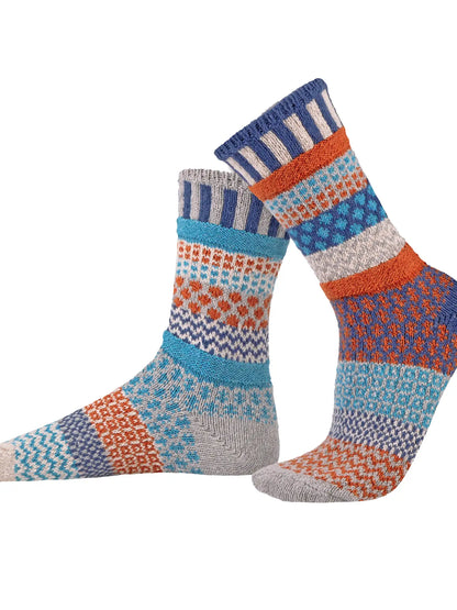 pair of Mirabell Crew Socks with similar but mismatched pattern shown on a white background
