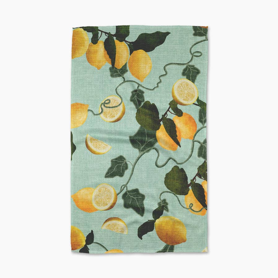 light blue towel with green vines and yellow lemons on it