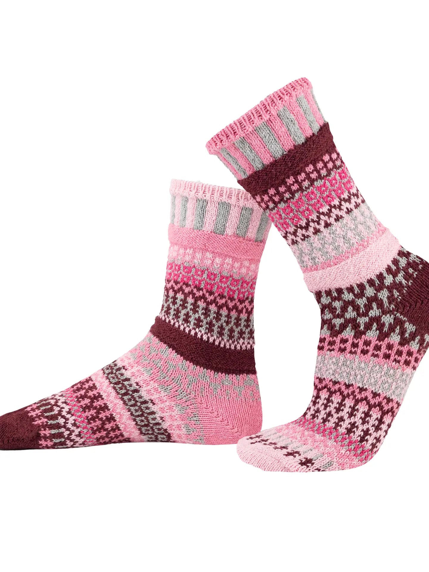pair of Alpenrose Crew Socks with similar but mismatched patterns shown on a white background