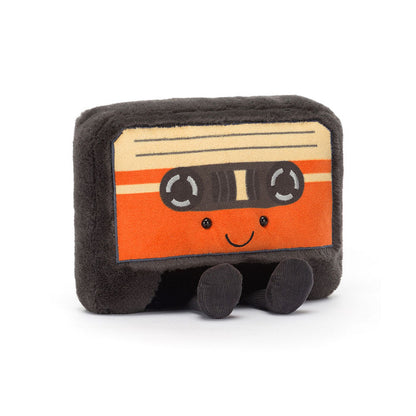 plush toy designed like a cassette tape with a smiling face and legs.