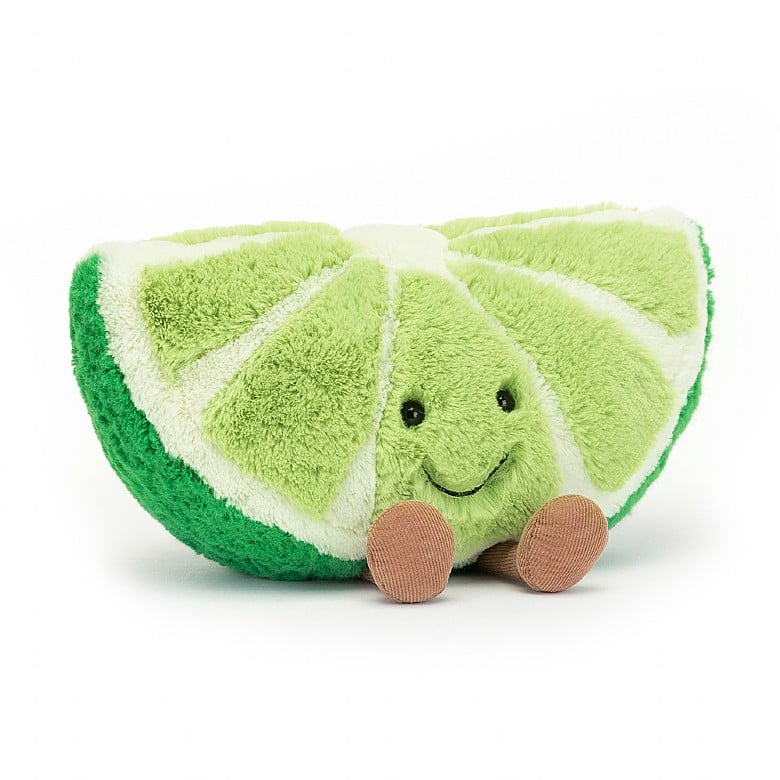 plush lime slice with smile face and legs on white background