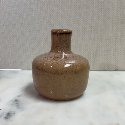 short taupe vase with slim neck.