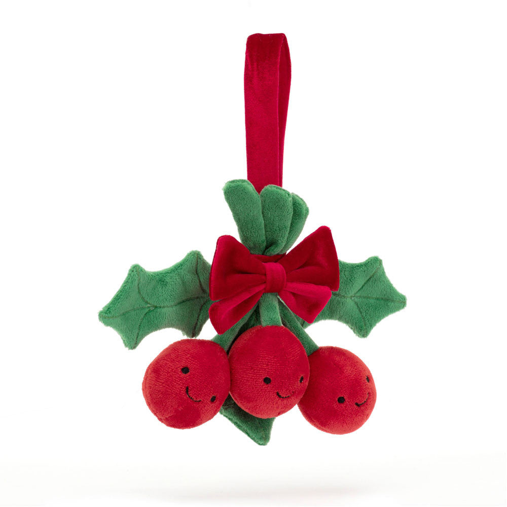 front view of Amuseables plush smiling holly leaves and berries with a red bow and ribbon 